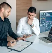 Two men seated at a desk
